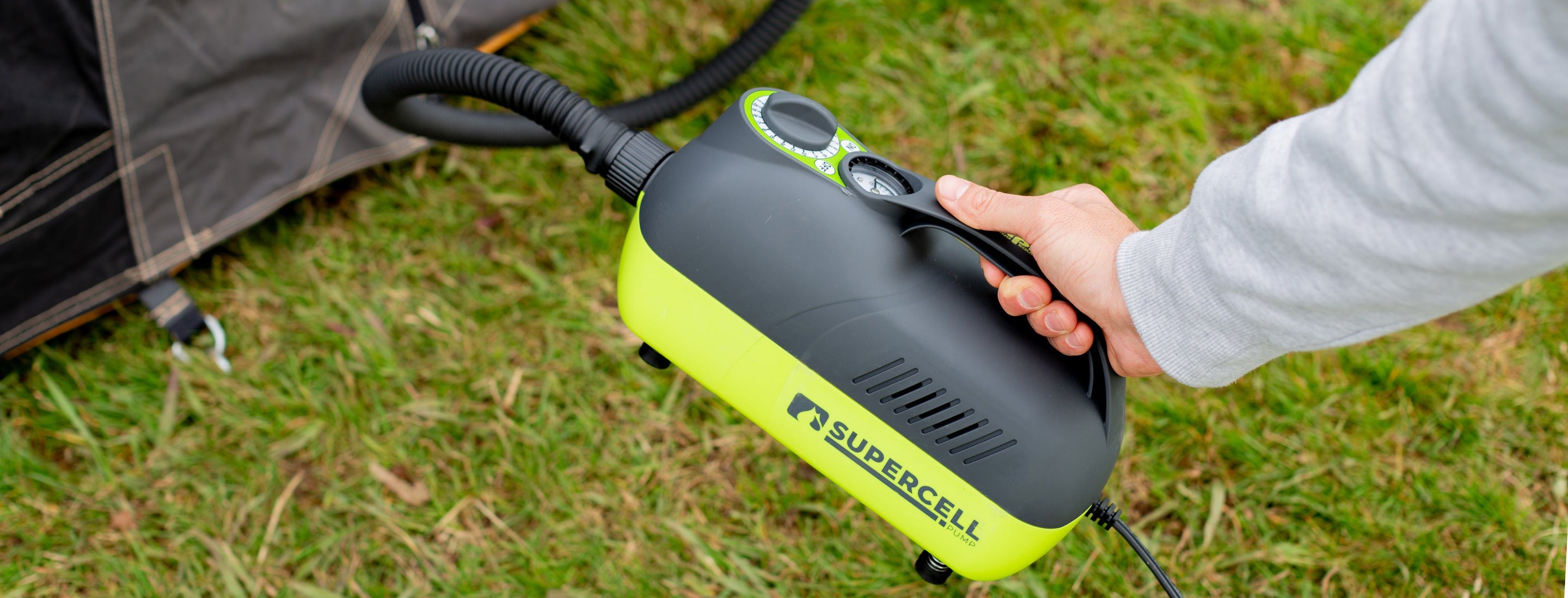 Person using a SuperCell air pump on grass